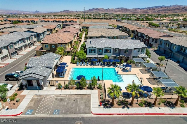 view of pool with a mountain view and a residential view