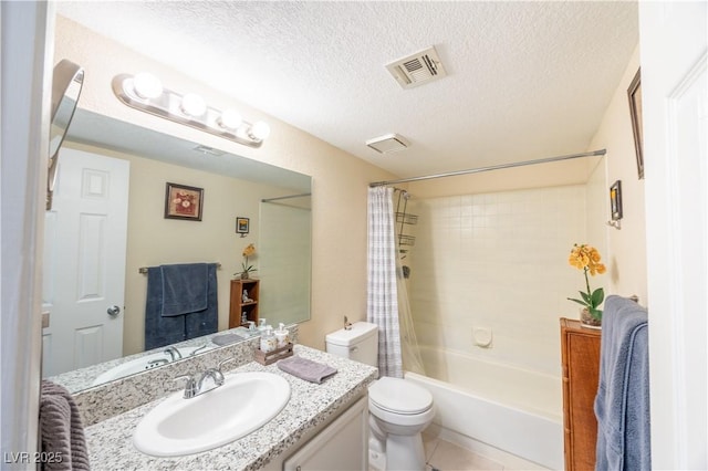 bathroom featuring visible vents, toilet, a textured ceiling, vanity, and tile patterned flooring