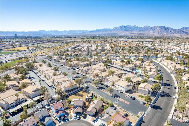 drone / aerial view featuring a residential view and a mountain view