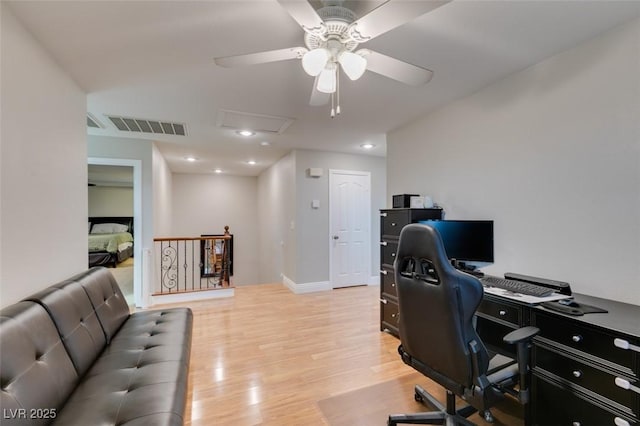 office space with ceiling fan, recessed lighting, visible vents, light wood finished floors, and attic access