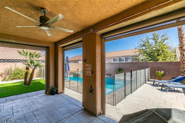 view of patio with ceiling fan and a fenced backyard