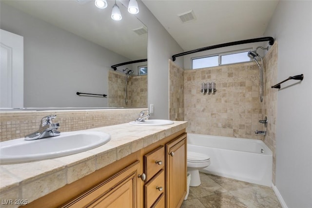 full bath featuring toilet, tasteful backsplash, visible vents, and a sink