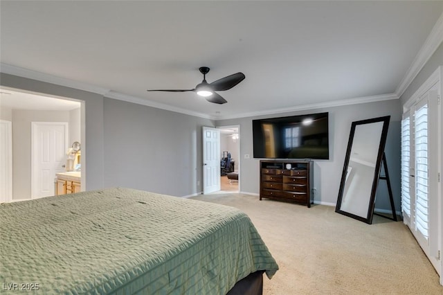 bedroom featuring light carpet, baseboards, ceiling fan, ensuite bathroom, and crown molding