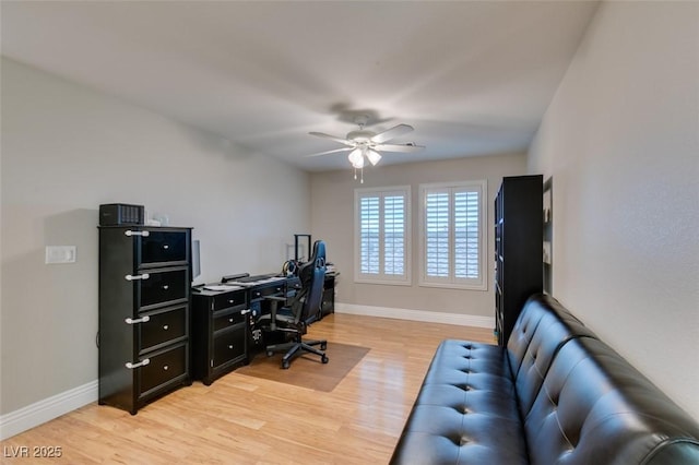 office with light wood-type flooring, ceiling fan, and baseboards