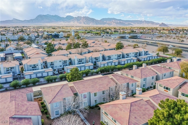 birds eye view of property with a residential view and a mountain view