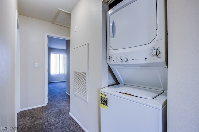 clothes washing area with laundry area, stacked washer / dryer, baseboards, carpet, and attic access