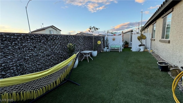 view of yard with a fenced backyard