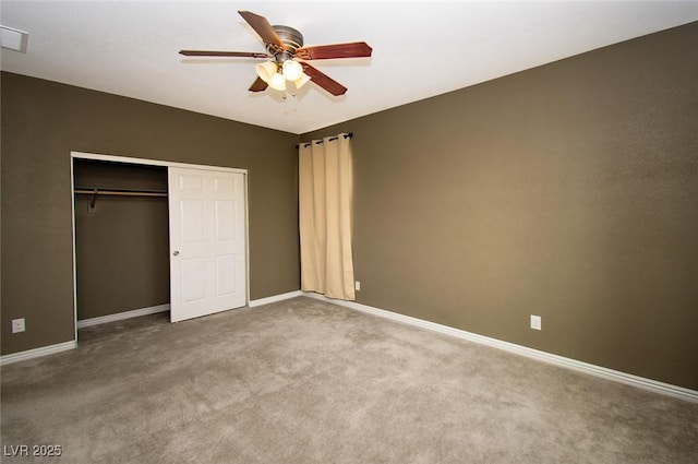 unfurnished bedroom with a ceiling fan, carpet, a closet, and baseboards