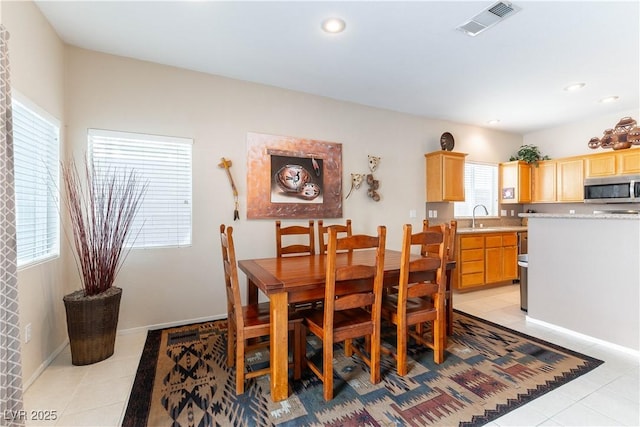 dining space with light tile patterned floors, visible vents, baseboards, and recessed lighting