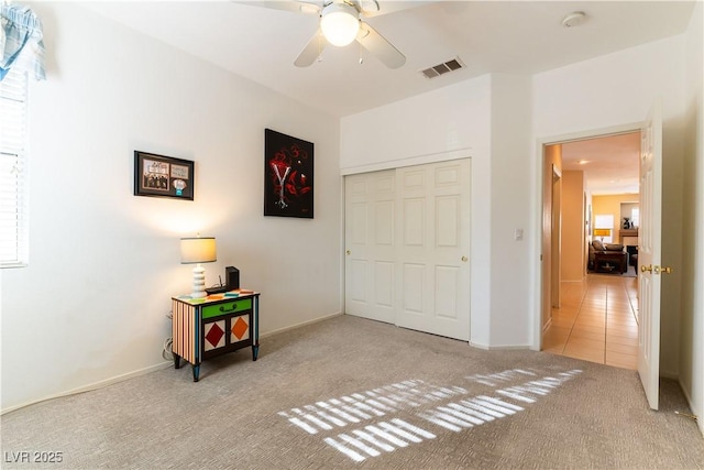 game room featuring visible vents, carpet, and a ceiling fan