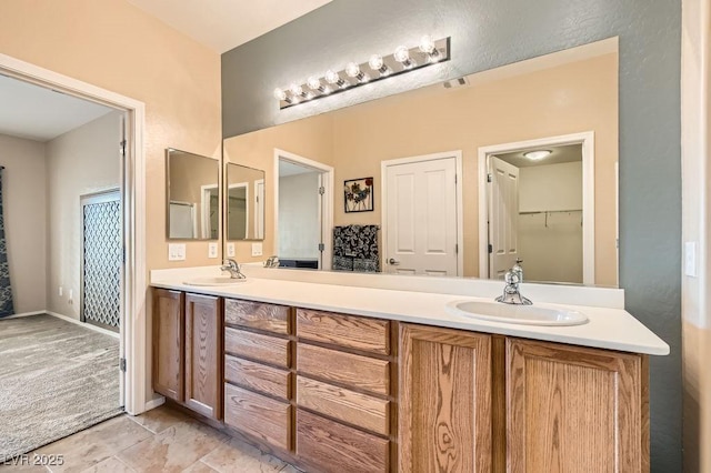 full bathroom featuring a sink, visible vents, and double vanity