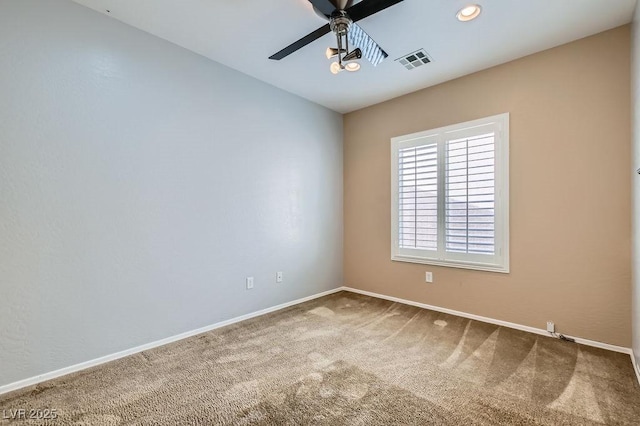 empty room with visible vents, recessed lighting, carpet flooring, baseboards, and ceiling fan