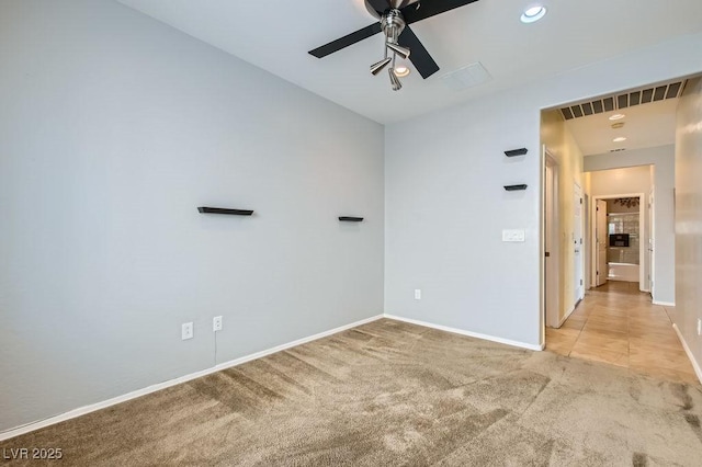 empty room with visible vents, baseboards, carpet floors, recessed lighting, and a ceiling fan