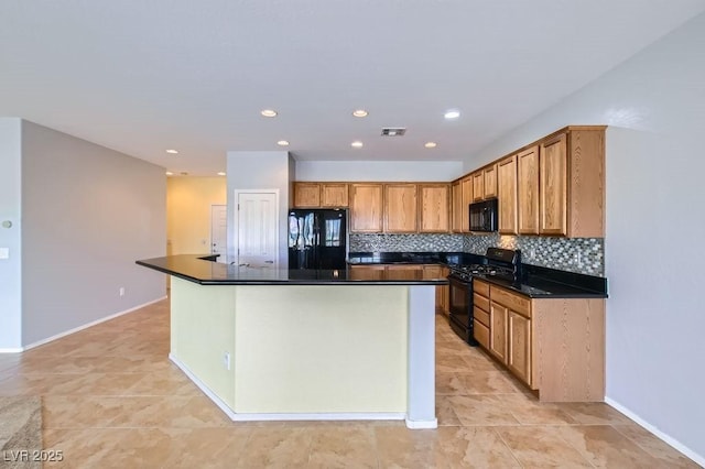 7567 Wingspread St, North Las Vegas, NV 89084 - kitchen with black appliances, dark countertops, tasteful backsplash, a center island, and recessed lighting