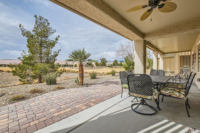 view of patio featuring outdoor dining area and ceiling fan