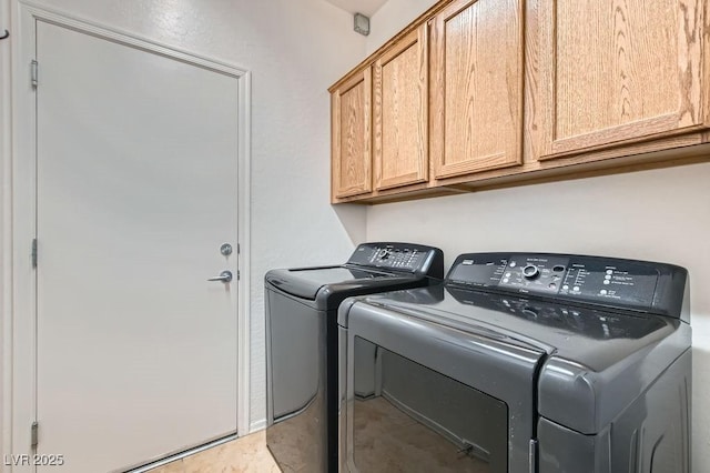 laundry room featuring cabinet space and independent washer and dryer