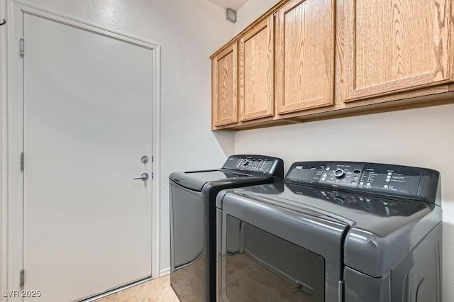 7567 Wingspread St, North Las Vegas, NV 89084 - laundry area featuring washing machine and dryer and cabinet space