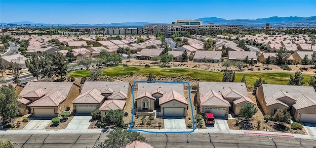 7567 Wingspread St, North Las Vegas, NV 89084 - aerial perspective of suburban area with mountains and a local golf course