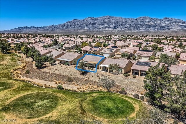 7567 Wingspread St, North Las Vegas, NV 89084 - aerial perspective of suburban area with a mountainous background