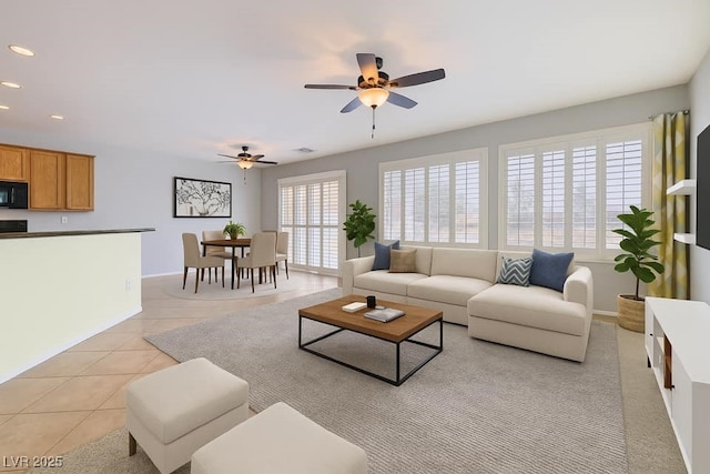 7567 Wingspread St, North Las Vegas, NV 89084 - living area with ceiling fan, recessed lighting, light tile patterned floors, and baseboards