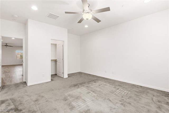 unfurnished bedroom featuring recessed lighting, visible vents, baseboards, and carpet flooring