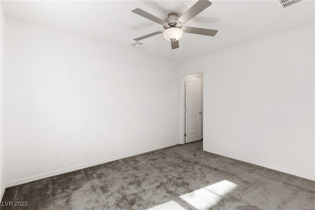 empty room featuring visible vents, carpet floors, baseboards, and ceiling fan