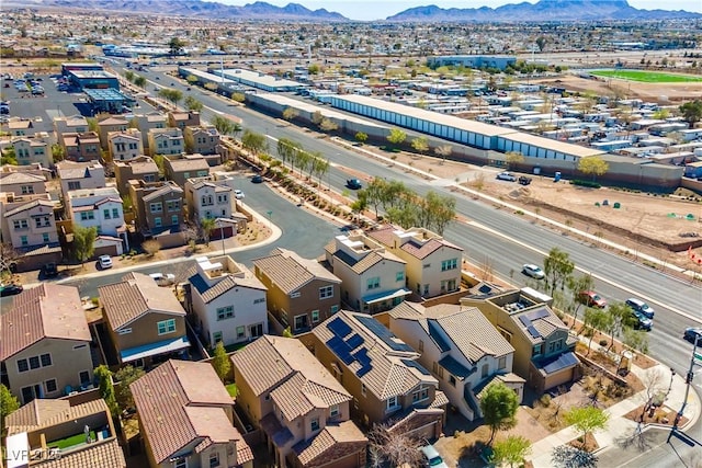 drone / aerial view featuring a residential view and a mountain view