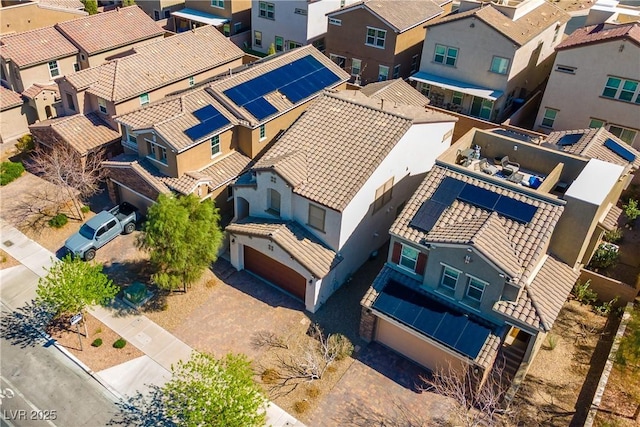 birds eye view of property with a residential view