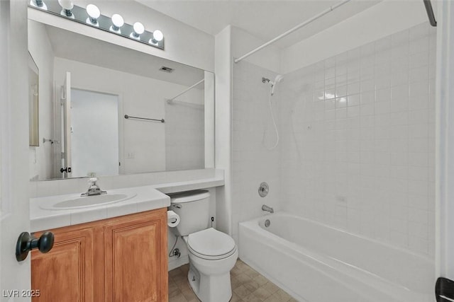 full bathroom with  shower combination, visible vents, vanity, and toilet