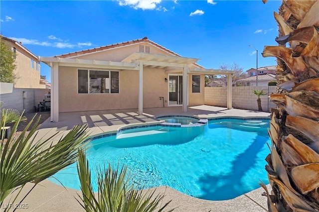 view of pool with a patio area, a fenced backyard, and a pool with connected hot tub