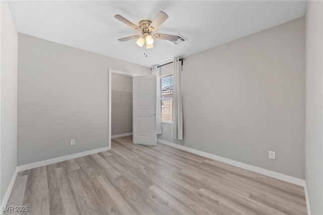 unfurnished bedroom featuring light wood-style floors and baseboards
