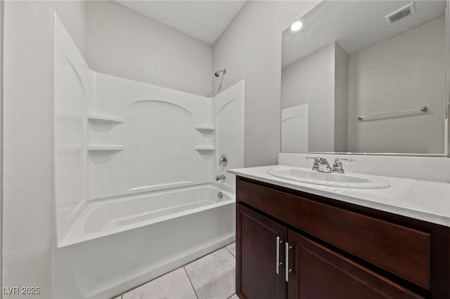 full bathroom with  shower combination, visible vents, tile patterned floors, and vanity