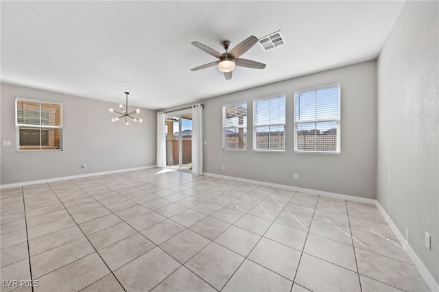 spare room featuring light tile patterned flooring, baseboards, visible vents, and ceiling fan with notable chandelier