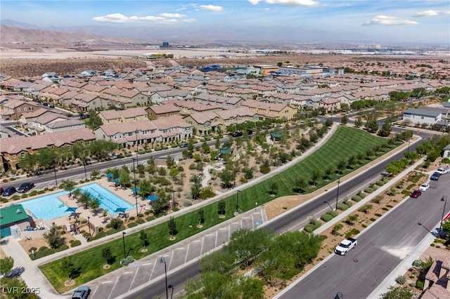 drone / aerial view featuring a residential view and a mountain view