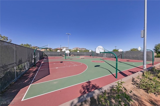 view of basketball court featuring community basketball court and fence