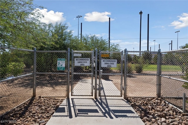 view of gate featuring fence