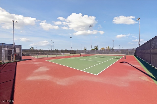 view of sport court with fence
