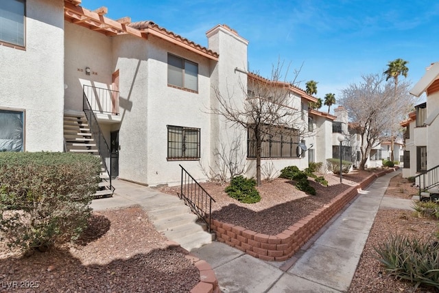 surrounding community with a residential view and stairway