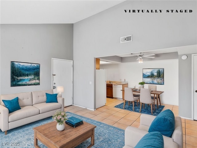 living room with light tile patterned floors, high vaulted ceiling, visible vents, and a ceiling fan