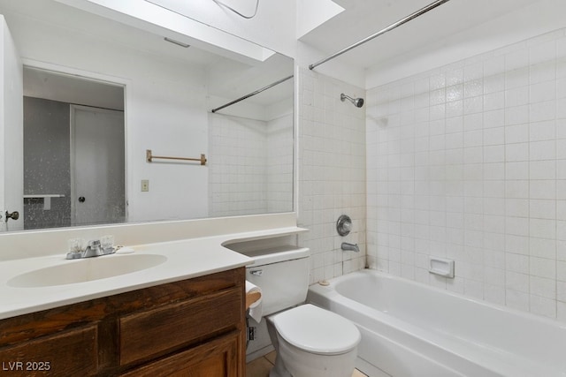 bathroom with toilet, shower / tub combination, and vanity