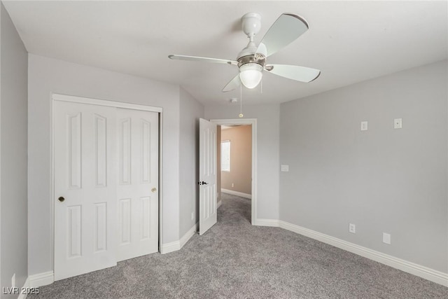 unfurnished bedroom featuring ceiling fan, a closet, carpet flooring, and baseboards