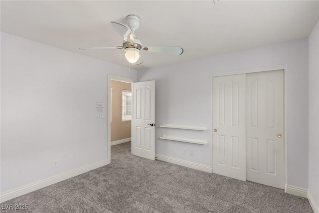 unfurnished bedroom featuring carpet, a closet, ceiling fan, and baseboards