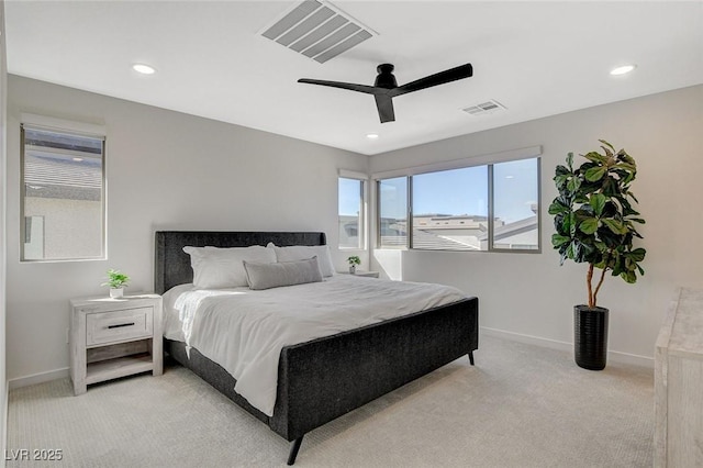 bedroom featuring light carpet, a ceiling fan, visible vents, and baseboards