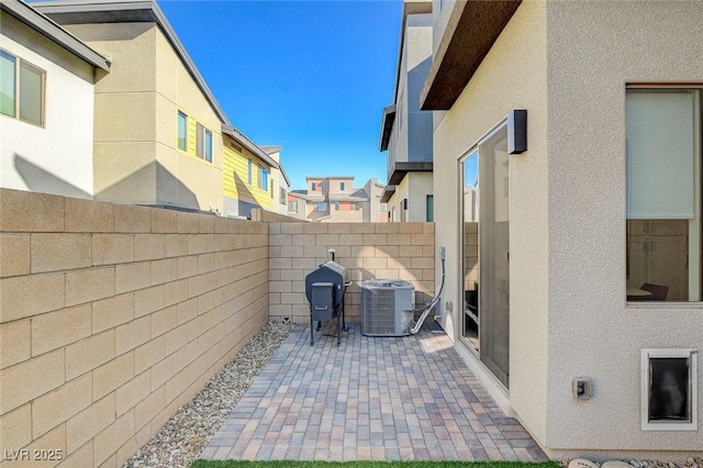 view of patio featuring a fenced backyard and cooling unit