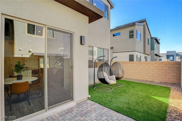 view of yard featuring fence and a patio