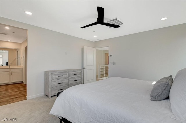 bedroom with recessed lighting, baseboards, visible vents, and light colored carpet