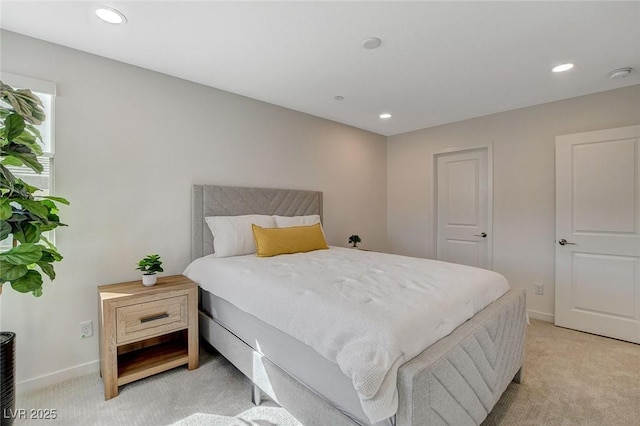 bedroom featuring baseboards, recessed lighting, and light colored carpet