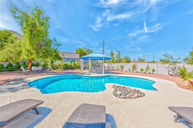 view of pool with a gazebo, a fenced in pool, a patio, and a fenced backyard