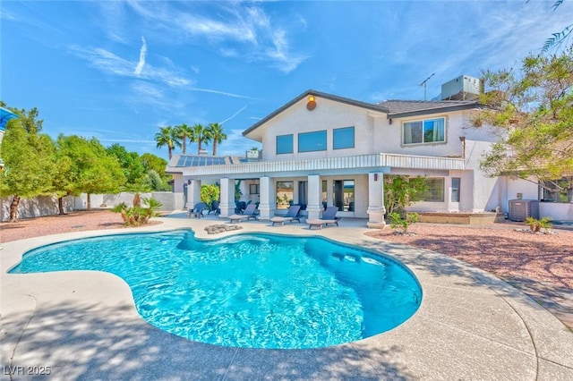 back of property featuring stucco siding, central AC, a fenced backyard, a fenced in pool, and a patio area