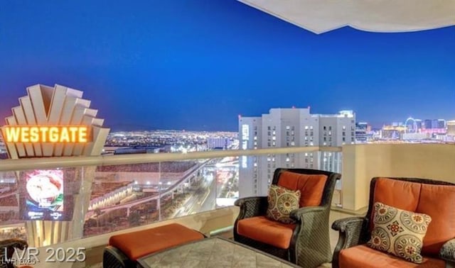 balcony featuring a view of city lights